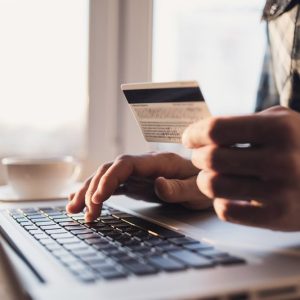 Man,Holding,Credit,Card,And,Using,Laptop.,Businessman,Or,Entrepreneur Man,Holding,Credit,Card,And,Using,Laptop.,Businessman,Or,Entrepreneur
