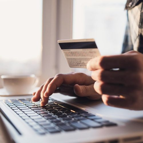 Man,Holding,Credit,Card,And,Using,Laptop.,Businessman,Or,Entrepreneur Man,Holding,Credit,Card,And,Using,Laptop.,Businessman,Or,Entrepreneur